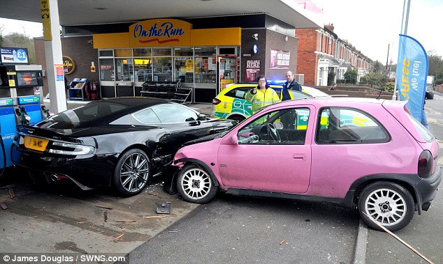 Pink Corsa crashed into black Aston Martin DBS - 1