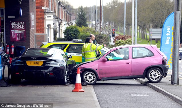 Pink Corsa crashed into black Aston Martin DBS - 3